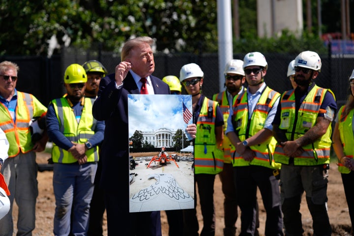 President Donald Trump speaks Wednesday at the construction site of the new helicopter landing zone on the South Lawn of the White House.