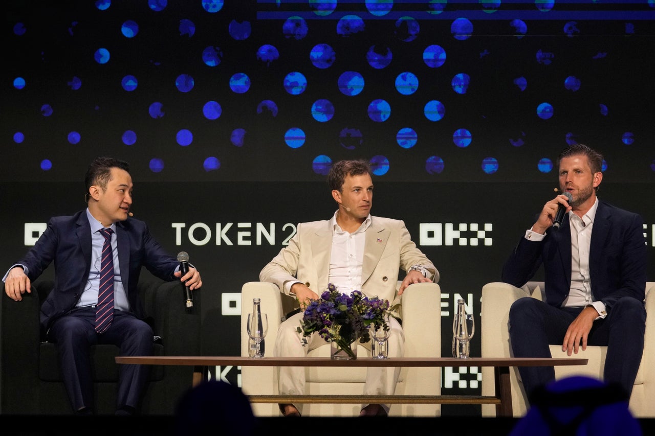 Eric Trump, executive vice president of the Trump Organization (right), co-founder of World Liberty Financial Zach Witkoff (center) and founder of TRON Justin Sun at a crypto event in Dubai.