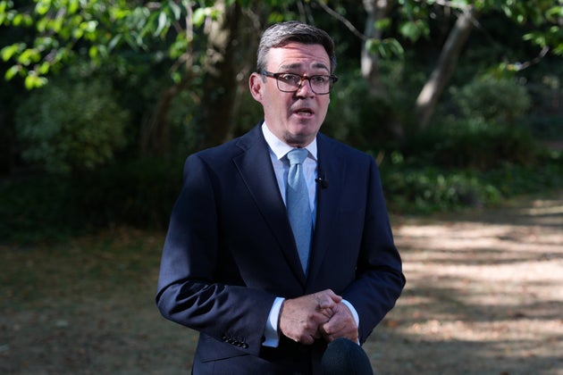 Britain's Prime Minister Andy Burnham speaks to the media after chairing a COBR meeting at Downing Street on the UK's ongoing response to extreme heat, wildfires and drought in London, Wednesday, Aug. 12, 2026.
