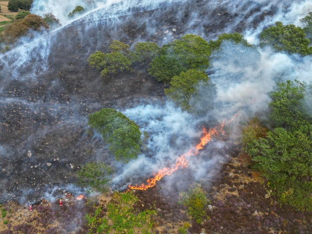 An aerial view of South Wales fire fighters tackling a raging wild fire on a mountain side above New Tredegar on August 19, 2026 in New Tredegar, Wales, United Kingdom. 