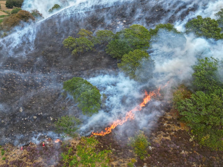 An aerial view of South Wales fire fighters tackling a raging wild fire on a mountain side above New Tredegar on August 19, 2026 in New Tredegar, Wales, United Kingdom.