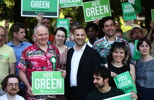 Britain's leader of the Green Party, Zack Polanski poses with supporters after speaking at a rally in a park in south London, on June 24, 2026.