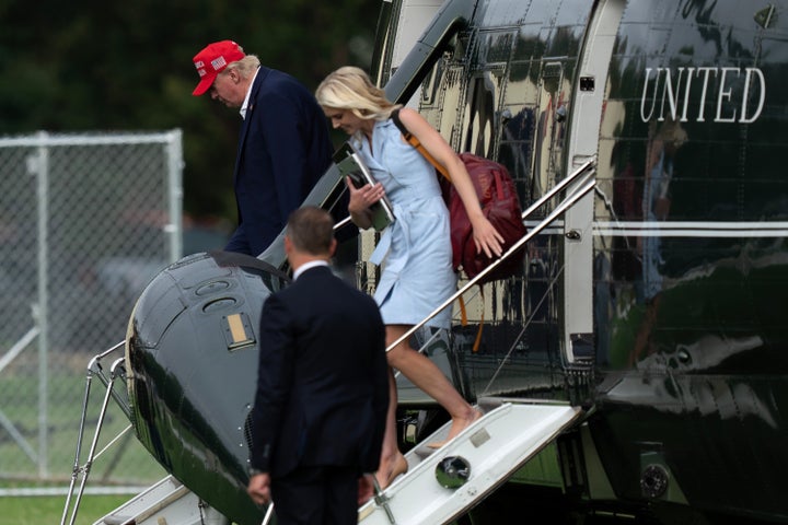 President Donald Trump and executive assistant Natalie Harp step off Marine One upon their arrival at the Ellipse just outside of the White House on Aug. 16.