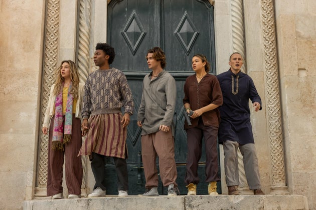 The cast of Outer Banks pictured on the set of season five