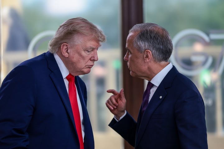 President Donald Trump speaks with Canadian Prime Minister Mark Carney, right, at a working lunch with leaders of G7 and the Middle East in Evian-les-Bains, France, Tuesday, June 16, 2026. (Evelyn Hockstein/Pool Photo via AP,File)