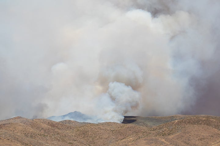 Fire crews and local agencies respond to a fast-moving wildfire on the dry hillsides outside Reno, Nevada, on August 22, 2026.