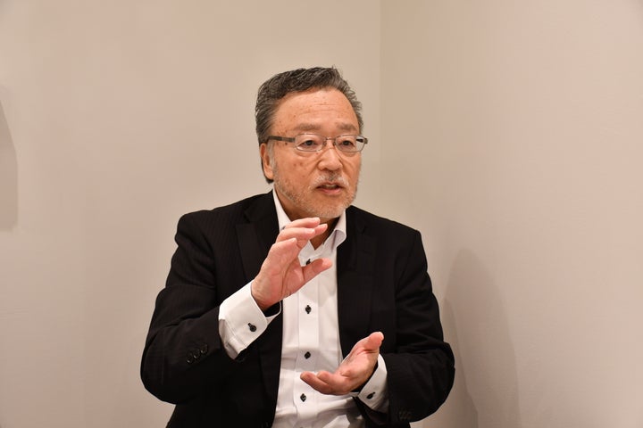 東京都内で取材に応える町おこしエネルギーの沼田昭二会長兼社長