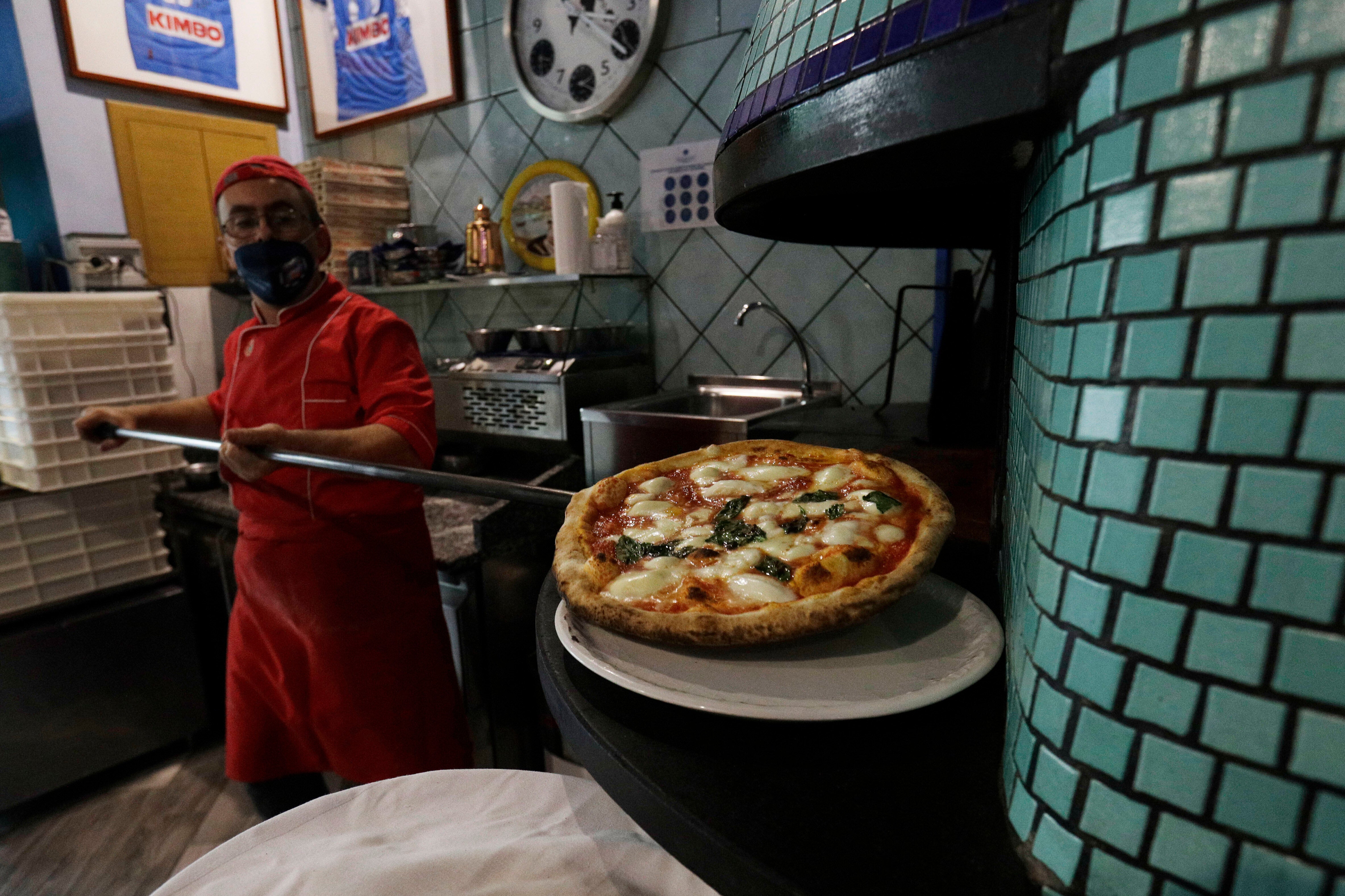 Italians Use Common Household Item To Cut Their Pizza — No Really