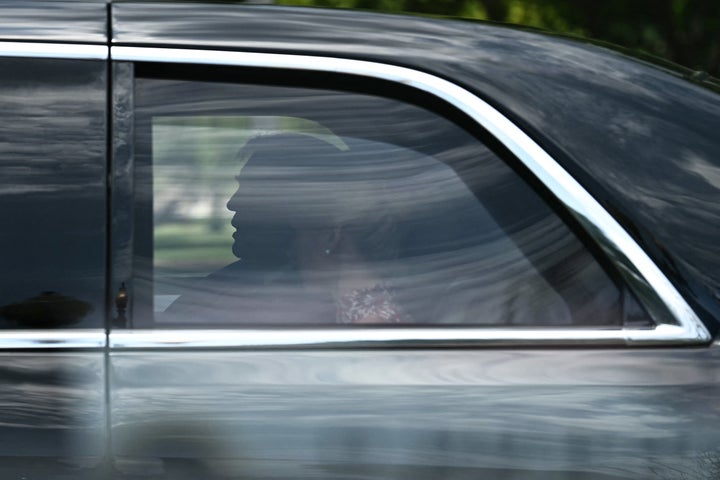 President Donald Trump rides in his motorcade with aide Natalie Harp as they depart the White House on the way to the Faith & Freedom Coalition's 2026 Policy Conference at the Washington Hilton in June.