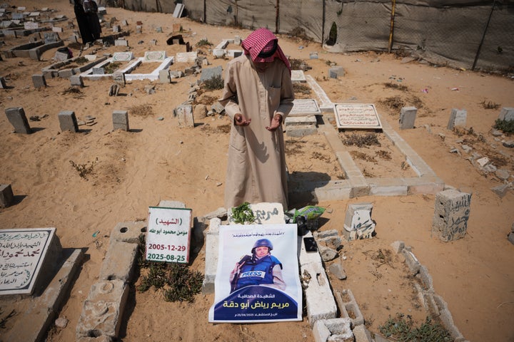 Riyad Abu Dagga, 69, visits the grave of his daughter, Mariam Dagga, a freelance journalist who worked with The Associated Press and other news outlets during the Gaza war and was killed in an Israeli airstrike on the Nasser Hospital building in Khan Younis on Aug. 25, 2025, at a cemetery in Khan Younis, Gaza Strip, Aug. 16, 2026.