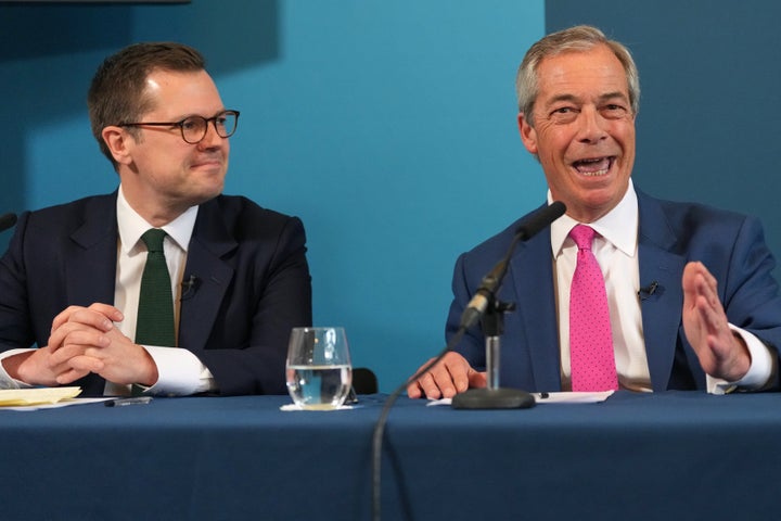 Nigel Farage, right, leader of Reform UK speaks at a press conference alongside Robert Jenrick Reform's Shadow Chancellor, in London, Thursday, April 2, 2026.