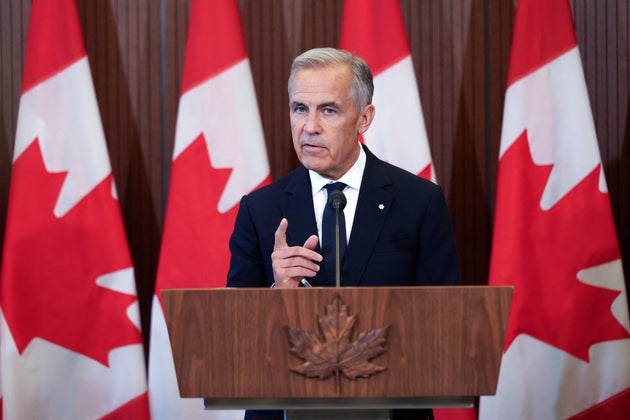 TOPSHOT - Canadian Prime Minister Mark Carney speaks at a press conference in Ottawa, Ontario, on Aug. 22, 2026, after trade talks with the U.S. collapsed. Carney said his country could not accept U.S. terms for a trade deal, and would slap retaliatory tariffs on steel and dairy products in response to heavy duties imposed by Washington. 