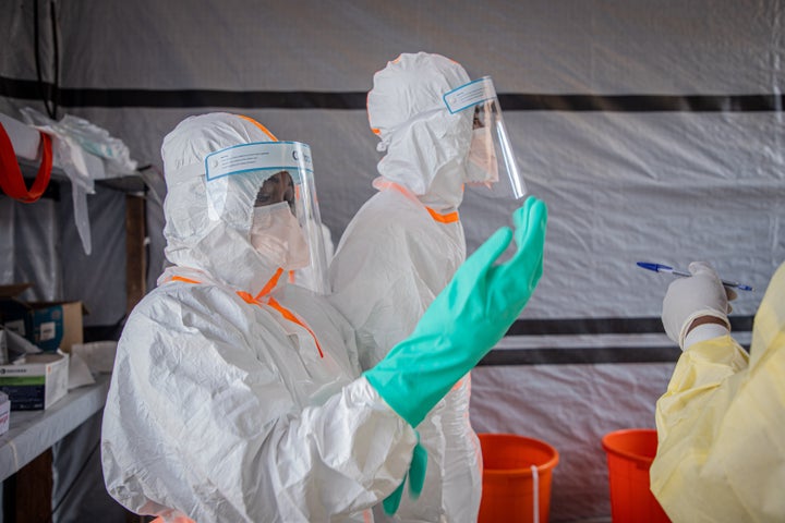 Medical workers put on protective suits at an Ebola treatment center in Bunia, the capital of Ituri Province in the Democratic Republic of the Congo, July 6, 2026. (Photo by Xinhua via Getty Images)
