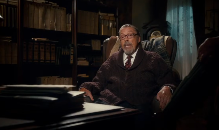 Tim Curry as The Criminologist in The Rocky Horror Picture Show: Let's Do The Time Warp Again