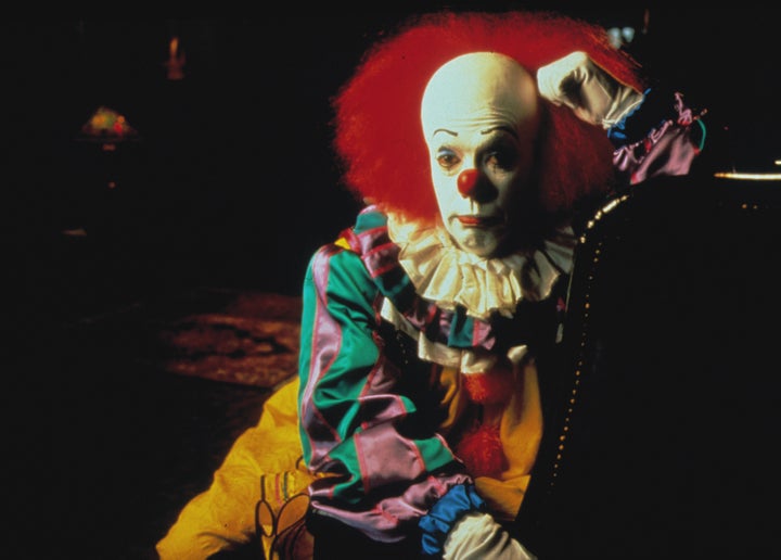 Tim Curry as Pennywise in It
