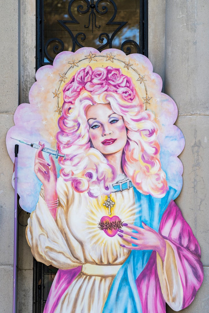 Artwork of Dolly Parton holding a vaccine syringe is displayed on a house float in New Orleans, Louisiana, during the 2021 Mardi Gras festivities which were mostly scaled back due to the pandemic.