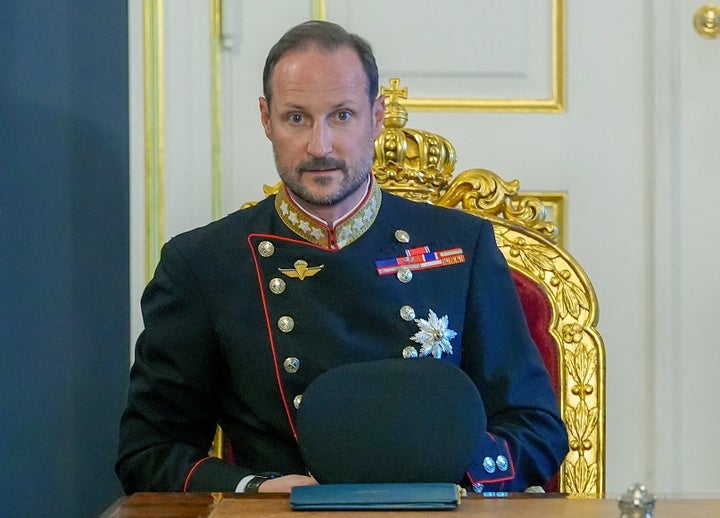 King Haakon VIII sits at the head of the table for an extraordinary cabinet meeting at the Royal Palace, in Oslo on Friday following the death of his father, King Harald V.