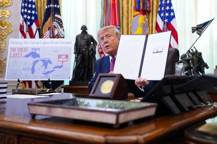 President Donald Trump displays a signed executive order to rename Lake Ontario as “Lake America” during an event in the Oval Office of the White House on Thursday.
