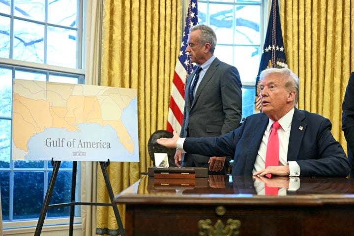 Trump points to a map reading “Gulf of America” as he speaks to the press after signing an executive order to change the name of the Gulf of Mexico in February 2025.