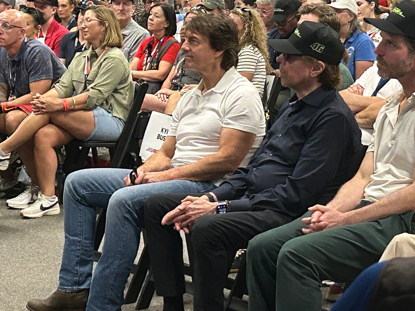 Actor Tom Cruise and movie producer Jerry Bruckheimer attend a drivers meeting before a NASCAR auto race at Daytona Inte