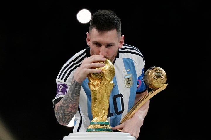 FILE - Argentina's Lionel Messi kisses the trophy after winning the World Cup final soccer match between Argentina and France in Lusail, Qatar, Dec. 18, 2022. Argentina won 4-2 in a penalty shootout after the match ended tied 3-3. (AP Photo/Martin Meissner, File)