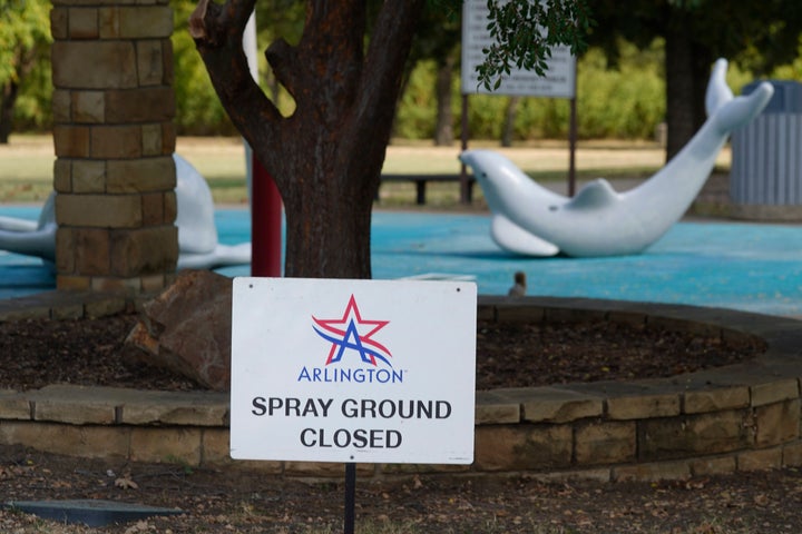 A sign announces the closure of a splash pad in Arlington, Texas, after a child was infected with Naegleria fowleri in 2021 and died.