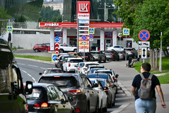 People queue to refuel their cars at a Lukoil petrol station in Moscow on June 30, 2026. Russia — one of the world's largest oil producers — has introduced a swath of restrictions on petrol sales across the country, as Ukrainian strikes on its refineries, depots and logistics crimp domestic supply.