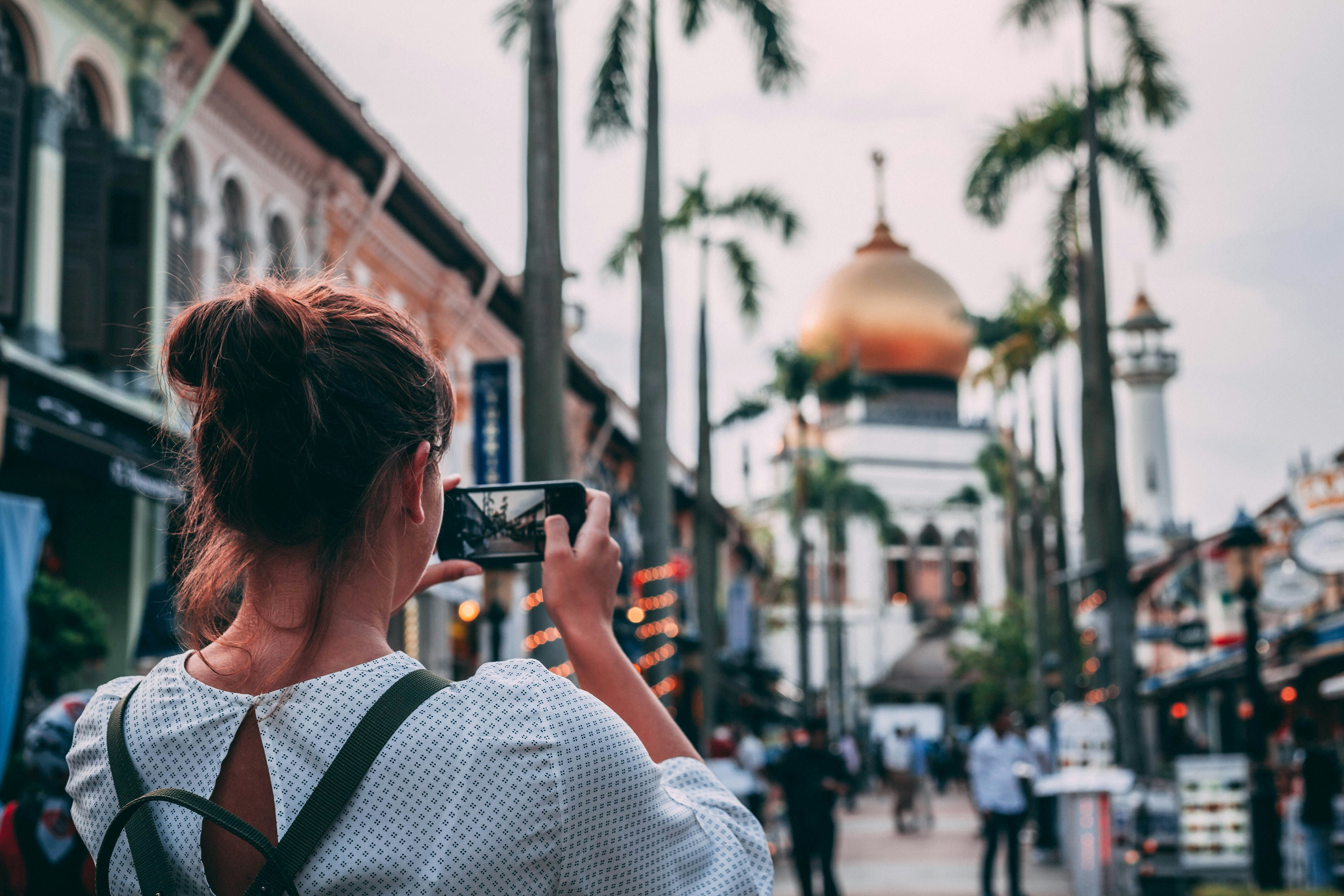 Always Taking Photos To Remember Moments? Science Says You're Doing The Opposite