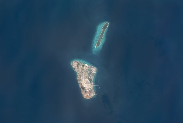 Maps4Media processed and enhanced Sentinal-2 satellite imagery shows Kharg Island and nearby Khargu Island in the Persian Gulf, including visible storage tank arrays, an airstrip, port infrastructure, and surrounding shallow-water zones. (Photo enhanced and published by maps4media via Getty Images)