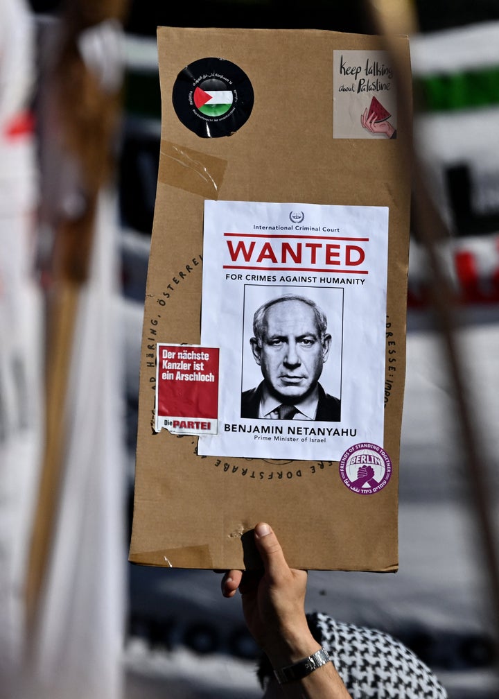 A protester displays a sign showing a makeshift “Wanted” poster of Israeli Prime Minister Benjamin Netanyahu, with the writing, “International Criminal Court - Wanted for Crimes Against Humanity” during a pro-Palestinian demonstration in Berlin on Sept. 27, 2025.