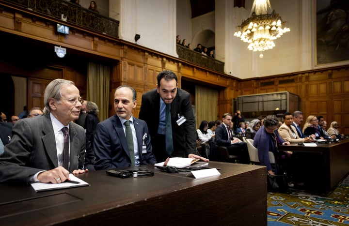Ambassador and Permanent Representative of the Palestinian Authority to International Organizations in the Netherlands Ammar Hijazi (C) attends the hearing of the International Court of Justice in The Hague on Oct. 22, 2025, to issue an advisory opinion on Israel's obligations to provide assistance in the occupied Palestinian territories.