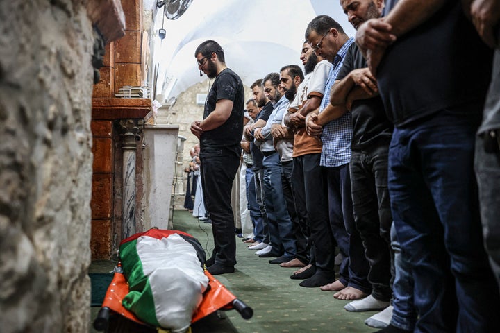 (EDITOR'S NOTE: Image depicts death) Men perform funeral prayers over the body of Omar Al-Tubasi inside a mosque in the town of Hajjah in the occupied West Bank, on Sept. 7, 2026. Al-Tubasi, a second-year dentistry student at Al-Najah National University, was allegedly shot by settlers.