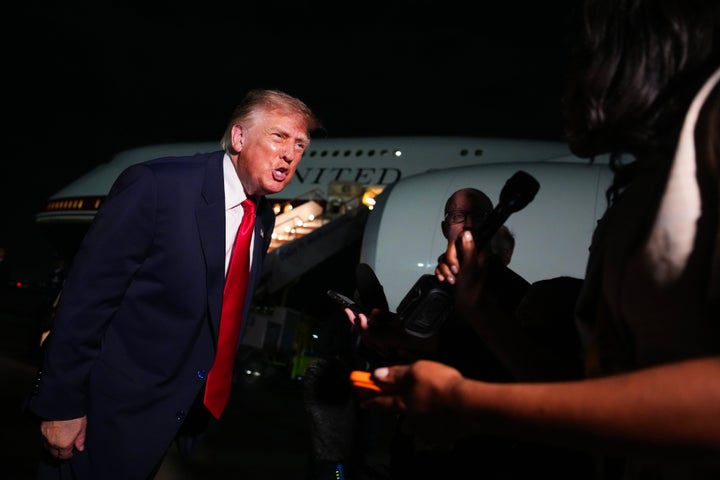 Trump speaks to reporters on the tarmac before boarding Air Force One after attending the Republican Midterm Convention on Sept. 10, in Dallas, Texas. 