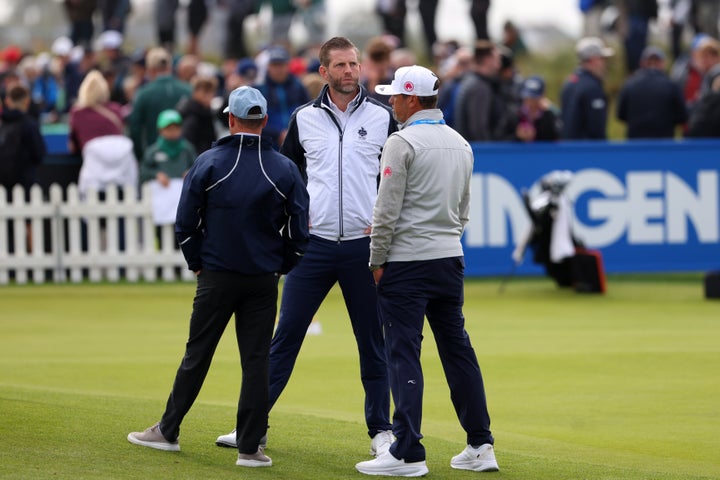 Eric Trump, center, son of U.S. President Donald Trump, stands on the practice ground during the Irish Open at Trump International Golf Links in Doonbeg, Ireland, Saturday, Sept. 12, 2026. (AP Photo/Peter Morrison)