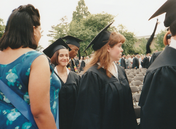 The author in her cap and gown at her college graduation in 1998.
