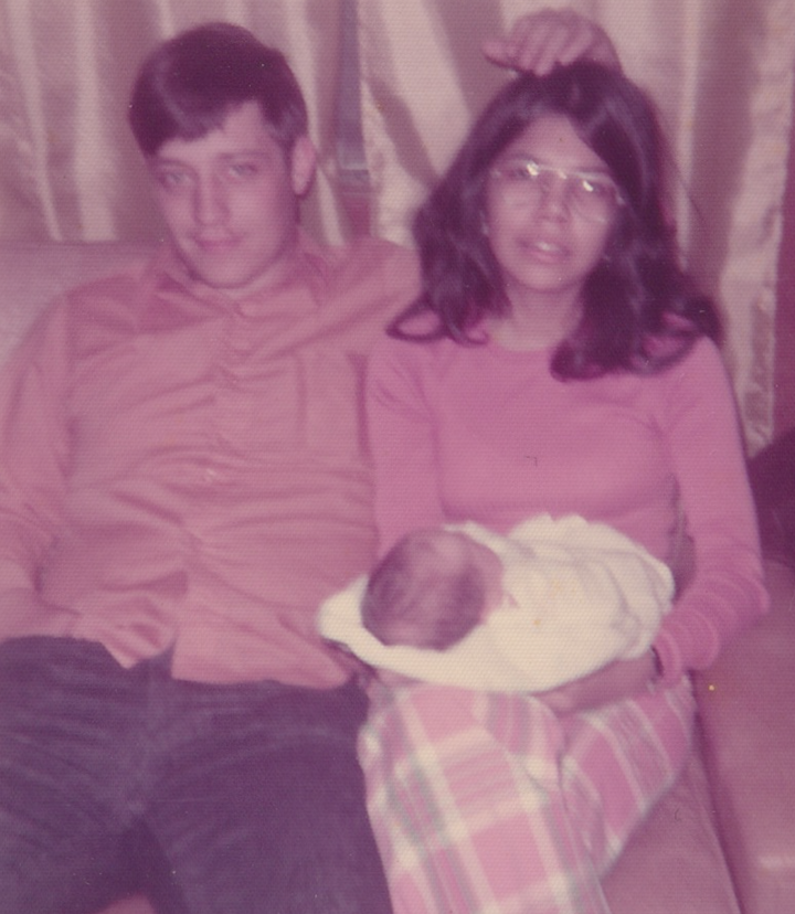 The author in a rare photo with both of her parents, who divorced when she was 1 year old.