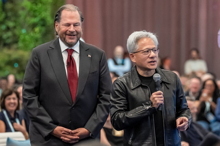 Marc Benioff (left), CEO of Salesforce Inc., and Jensen Huang, CEO of Nvidia Corp., are seen during the 2026 Dreamforce conference in San Francisco on Tuesday.