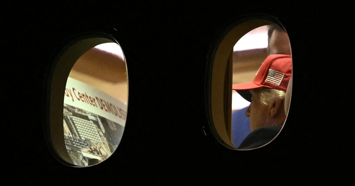 Photos Show President Trump Reviewing Poster Regarding Kennedy Center and Demolition