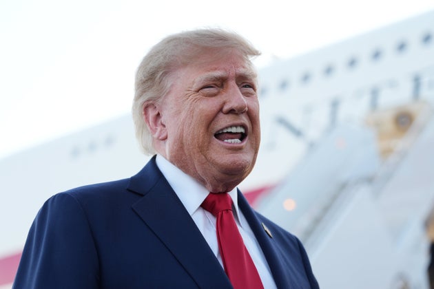 Donald Trump speaks to reporters at Charlotte Douglas International Airport.