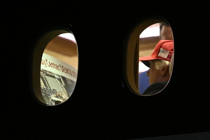 President Donald Trump is seen aboard Air Force One checking a Kennedy Center large printout after landing at Joint Base Andrews, Maryland, on Sept. 16, 2026. Trump, who is returning from Gastonia, North Carolina, after campaigning for Republican US Senate candidate Michael Whatley, threatened on Sept. 15, 2026, to keep the Kennedy Center closed for good after a judge ruled that his name cannot be added to the famed arts institution's facade.