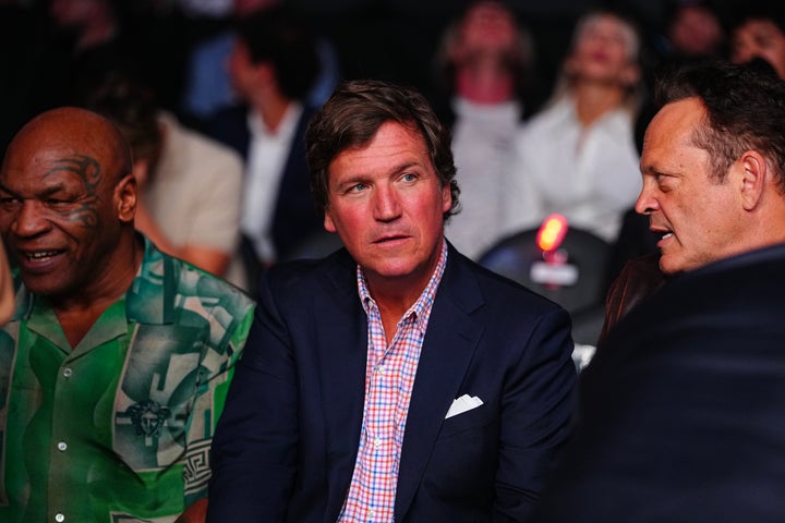Carlson pictured here with boxer Mike Tyson and actor Vince Vaughn at the UFC 329 fight in Las Vegas this July.