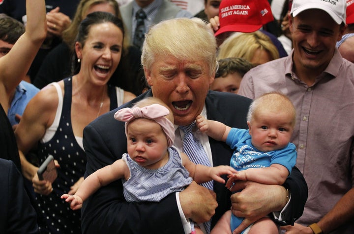 Trump holds two babies after speaking in Colorado Springs, Colorado, on July 29, 2016.