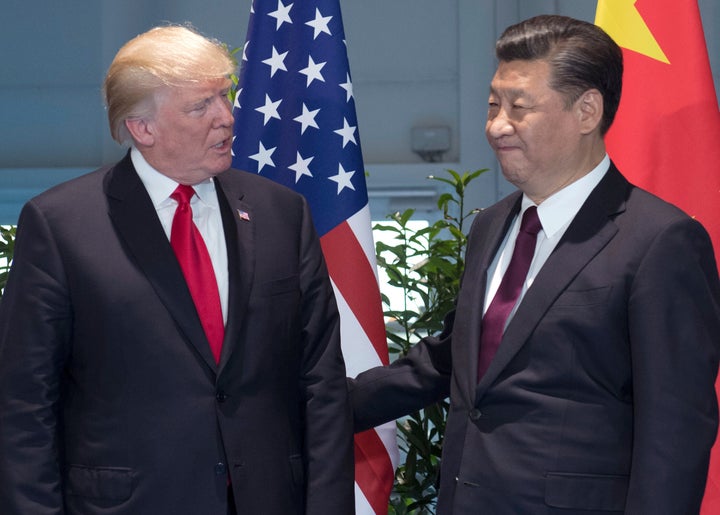 FILE - President Donald Trump, left, and Chinese President Xi Jinping arrive for a meeting on the sidelines of the G-20 Summit in Hamburg, Germany, July 8, 2017.