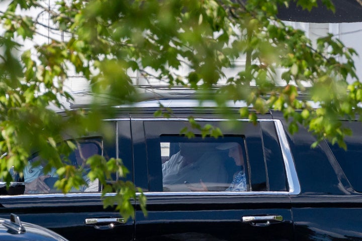 President Donald Trump and executive assistant Natalie Harp are seen in the presidential limo as they depart Trump National Golf Course on Aug. 30 in Sterling, Virginia.