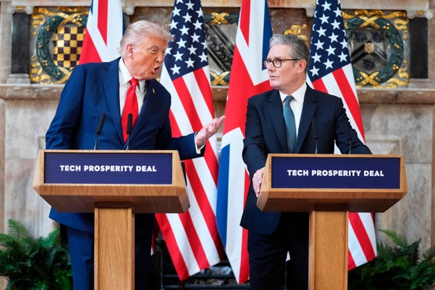 Donald Trump gestures next to Keir Starmer during a joint press conference at Chequers a year ago.