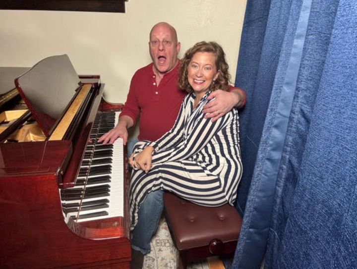 My husband and I went viral on TikTok in our 40s and 60s 1 The author and her husband, Joshua, at the piano in their living room.