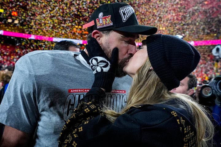 Travis Kelce and Taylor Swift share a kiss in January 2025