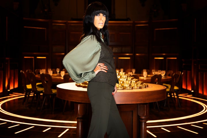 Claudia Winkleman strikes a pose in the Traitors castle