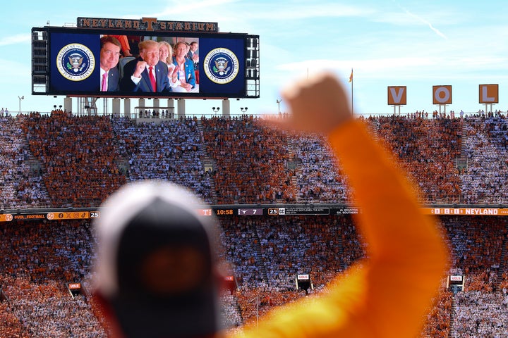 U.S. President Donald Trump, Sen. Bill Hagerty (R-TN) (L) and Sen. Marsha Blackburn (R-TN) appear on a video screen while attending the Texas-Tennessee football game at Neyland Stadium on September 26, 2026 in Knoxville, Tennessee. (Photo by Tom Brenner/Getty Images)