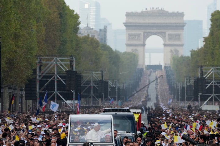 Pope Leo XIV greets faithful as he arrives to celebrate mass at Place de la Concorde, Paris, Saturday, Sept. 26, 2026. (AP Photo/Gregorio Borgia)